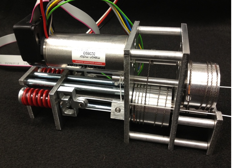 Maxon motor driving a cable-and-pulley reduction with spring tensioners